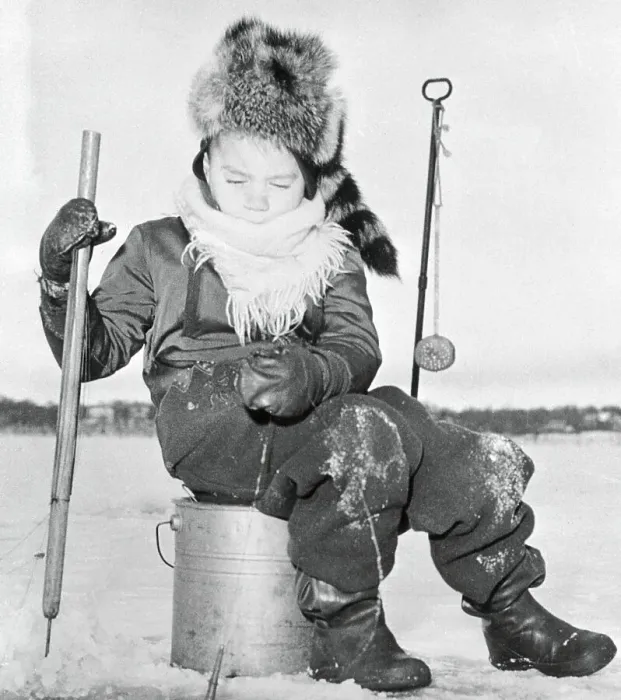Framed Print : Young boy (6-7) ice fishing, Minneapolis, Minnesota, USA Framed Print : Young boy (6-7) ice fishing, Minneapolis, Minnesota, USA