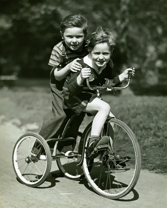 Framed Print : Young boy and girl on bike Framed Print : Young boy and girl on bike