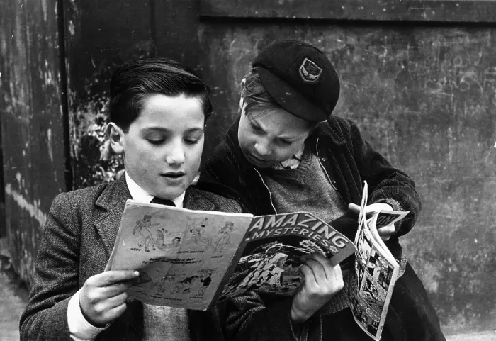 Framed Print : Coo !. 17th May 1952: Two young boys reading comics