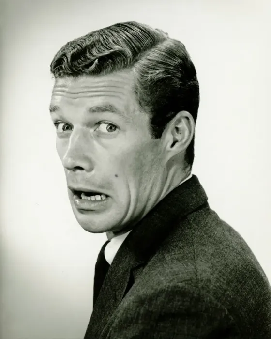 Framed Print : Young businessman looking frightened, posing in studio, (B&W), portrait Framed Print : Young businessman looking frightened, posing in studio, (B&W), portrait