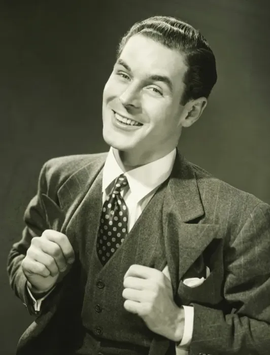 Framed Print : Young businessman in studio smiling, (B&W), portrait Framed Print : Young businessman in studio smiling, (B&W), portrait