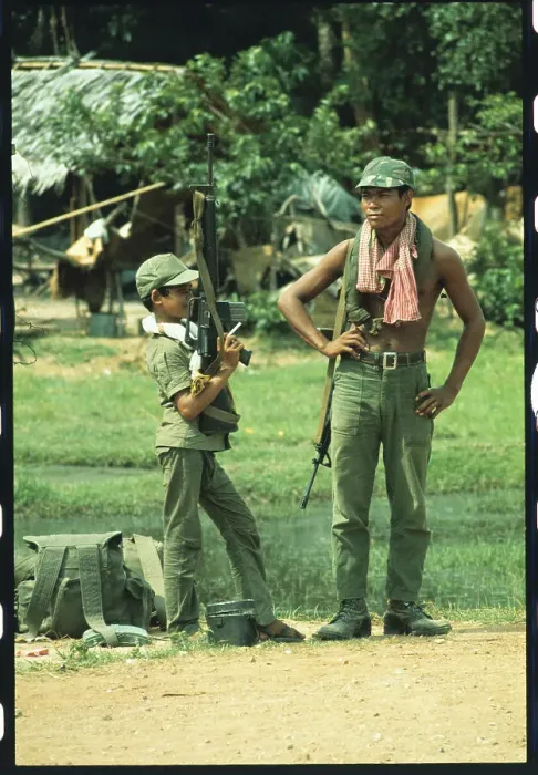 Framed Print : Young Cambodian Holding an M-16 Framed Print : Young Cambodian Holding an M-16