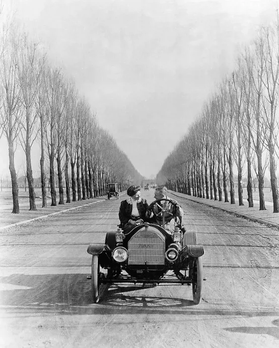 Framed Print : Young Couple Driving an Open Car Framed Print : Young Couple Driving an Open Car