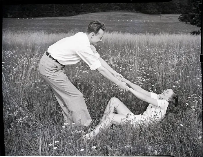 Framed Print : Young Couple Frolicking in Grass Framed Print : Young Couple Frolicking in Grass