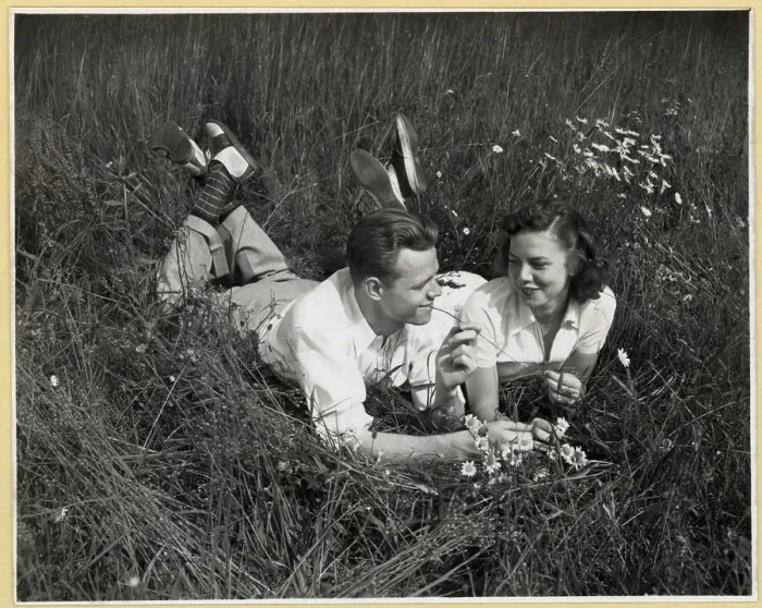 Framed Print : Young Couple Lying on Grass Framed Print : Young Couple Lying on Grass