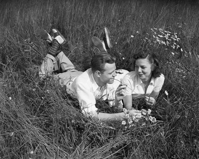 Framed Print : Young Couple Lying in the Grass