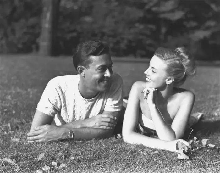 Framed Print : Young couple lying on lawn, (B&W)