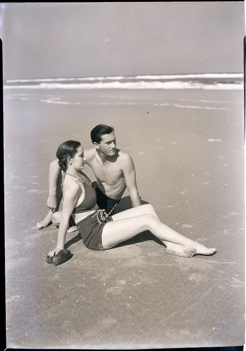 Framed Print : Young Couple Seated on Beach Framed Print : Young Couple Seated on Beach