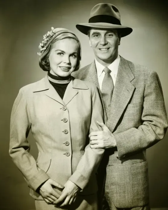 Framed Print : Young couple in studio, man holding woman, smiling, (B&W), portrait Framed Print : Young couple in studio, man holding woman, smiling, (B&W), portrait