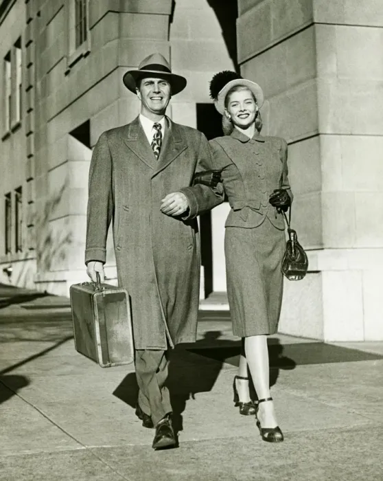 Framed Print : Young couple walking arm in arm on sidewalk, (B&W)