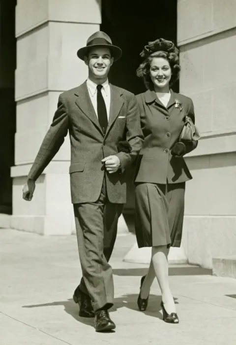 Framed Print : Young couple walking arm in arm on sidewalk, (B&W) Framed Print : Young couple walking arm in arm on sidewalk, (B&W)