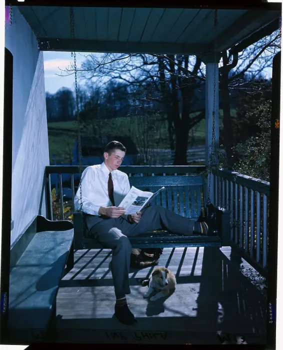 Framed Print : Young Farmer Reading a Magazine Framed Print : Young Farmer Reading a Magazine