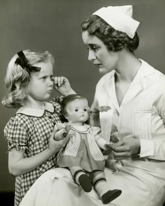Framed Print : Young girl and nurse holding doll Framed Print : Young girl and nurse holding doll