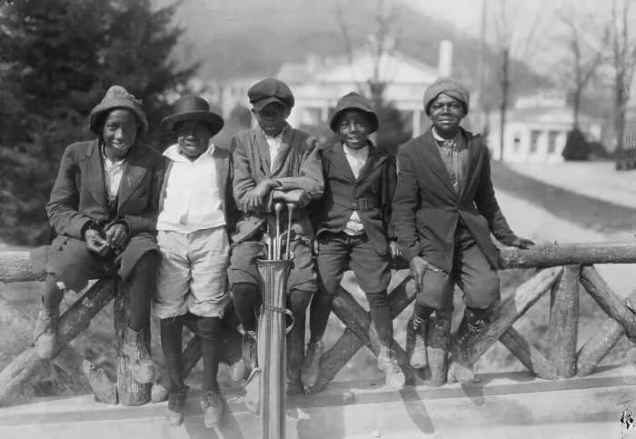 Framed Print : Young Golf Caddies Sitting on Fence Framed Print : Young Golf Caddies Sitting on Fence