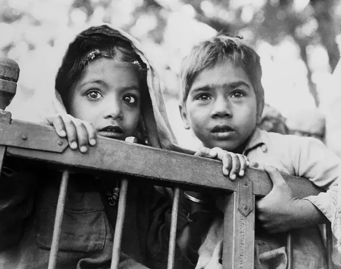 Framed Print : Two Young Indian Children Holding to Side of Cart