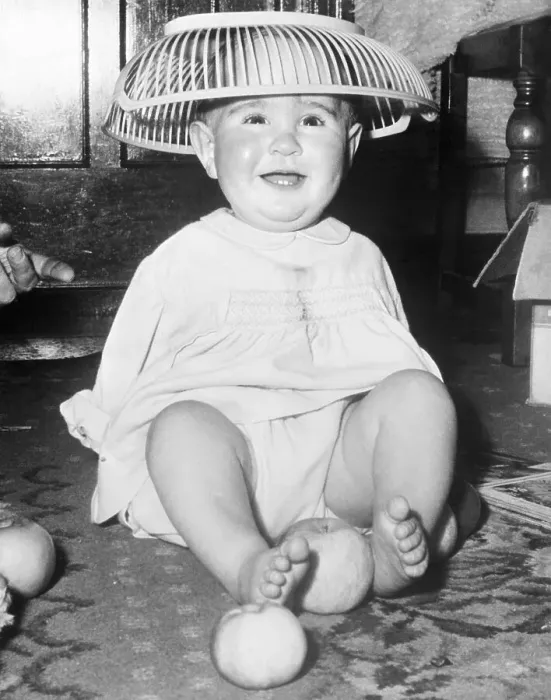 Framed Print : Young Infant Child Wearing Basket on his Head Framed Print : Young Infant Child Wearing Basket on his Head
