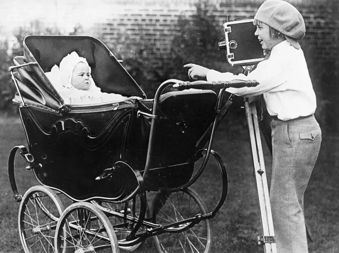 Framed Print : Young Jackie Coogan Taking Picture of His Infant Brother Framed Print : Young Jackie Coogan Taking Picture of His Infant Brother