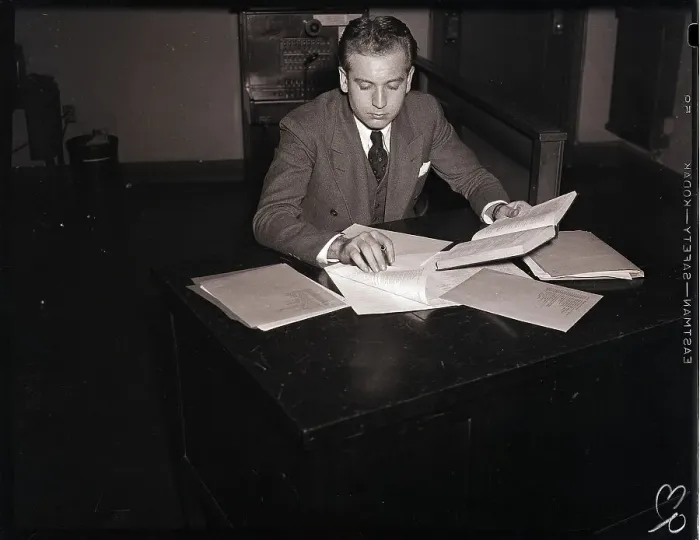 Framed Print : Young Man at Desk Preparing a Report