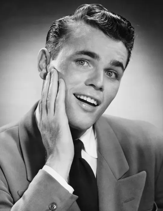 Framed Print : Young man with hand on cheek, posing in studio, (B&W), (Close-up), (Portrait) Framed Print : Young man with hand on cheek, posing in studio, (B&W), (Close-up), (Portrait)