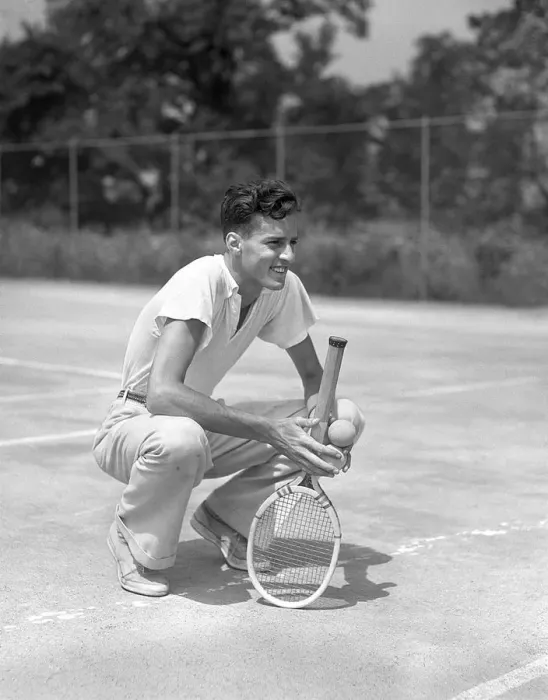 Framed Print : Young Man Smiling Squatting Holds Tennis Racquet A Framed Print : Young Man Smiling Squatting Holds Tennis Racquet A