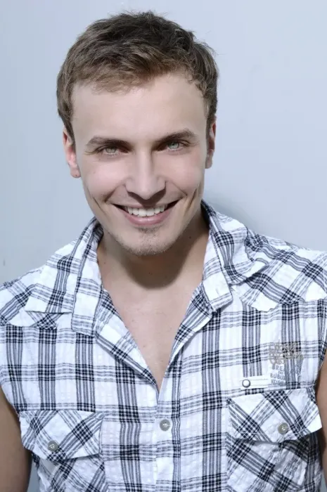 Framed Print : Young man smiling, wearing a check shirt, portrait