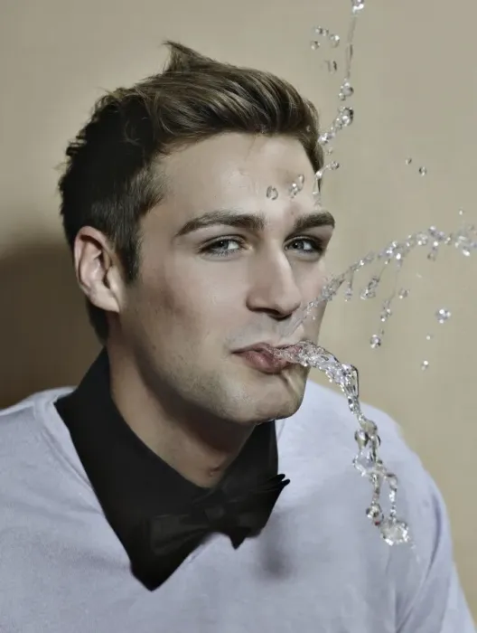Framed Print : Young man spitting out water Framed Print : Young man spitting out water