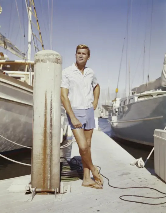 Framed Print : Young man standing at harbour Framed Print : Young man standing at harbour