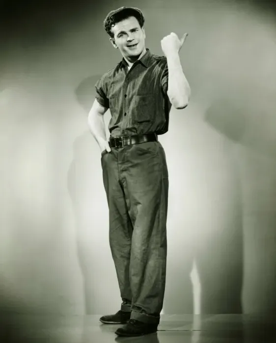 Framed Print : Young man standing in studio, gesturing, (B&W) Framed Print : Young man standing in studio, gesturing, (B&W)