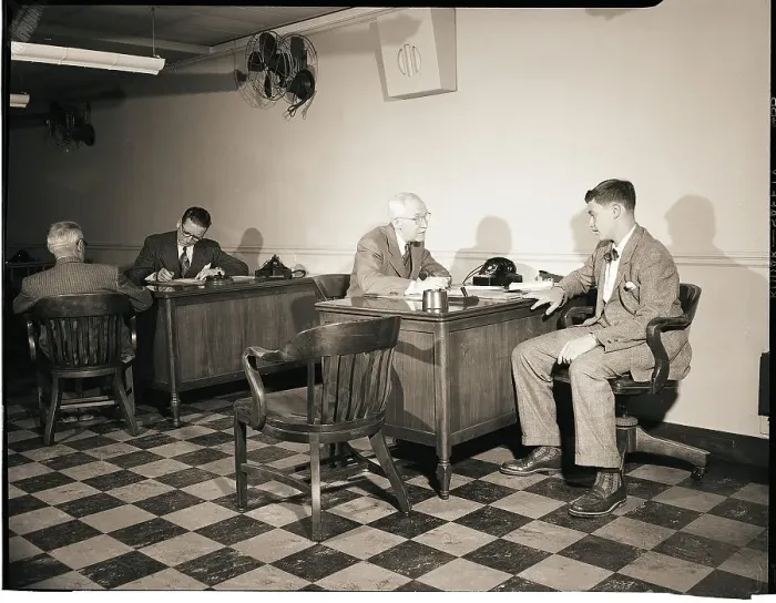 Framed Print : Young Man Talks To Banker