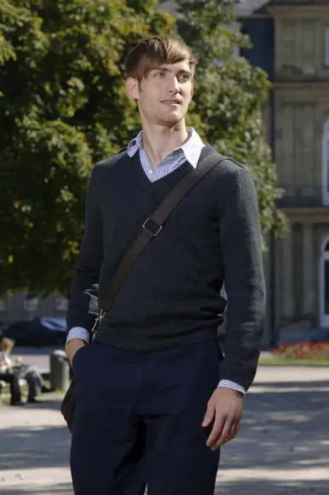 Framed Print : Young man wearing elegant clothing with a bag over his shoulder in front of the New Palace in Stuttgart, Baden-Wuerttemberg, Germany, Europe Framed Print : Young man wearing elegant clothing with a bag over his shoulder in front of the New Palace in Stuttgart, Baden-Wuerttemberg, Germany, Europe