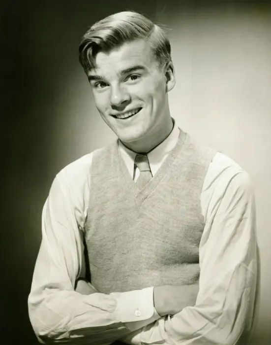 Framed Print : Young man wearing jumper, smiling, (B&W), portrait Framed Print : Young man wearing jumper, smiling, (B&W), portrait