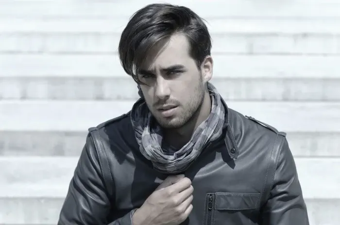Framed Print : Young man wearing a leather jacket in front of an open staircase, portrait of a young rocker Framed Print : Young man wearing a leather jacket in front of an open staircase, portrait of a young rocker