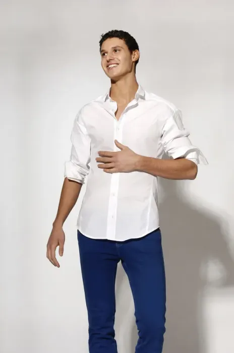 Framed Print : Young man in white shirt and blue jeans in movement Framed Print : Young man in white shirt and blue jeans in movement