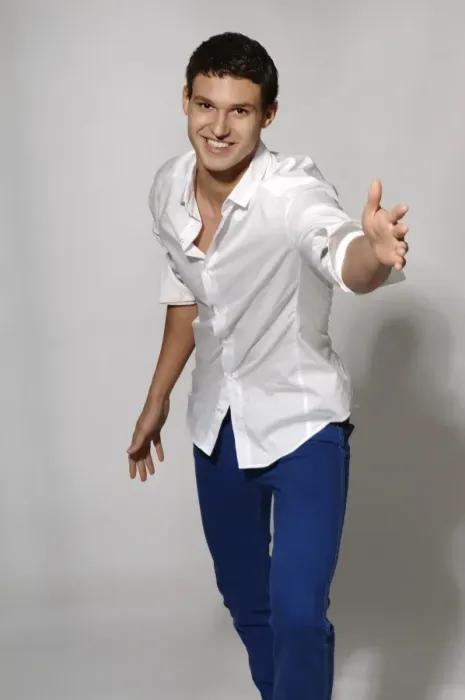 Framed Print : Young man in white shirt and blue jeans in movement Framed Print : Young man in white shirt and blue jeans in movement