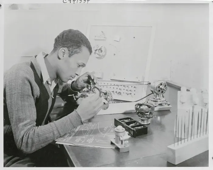 Framed Print : Young Man Working with Technical Device Framed Print : Young Man Working with Technical Device