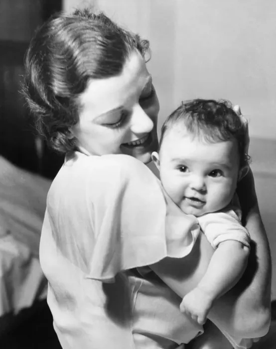 Framed Print : Young mother holding baby boy (9-12 months) in arms, (B&W) Framed Print : Young mother holding baby boy (9-12 months) in arms, (B&W)