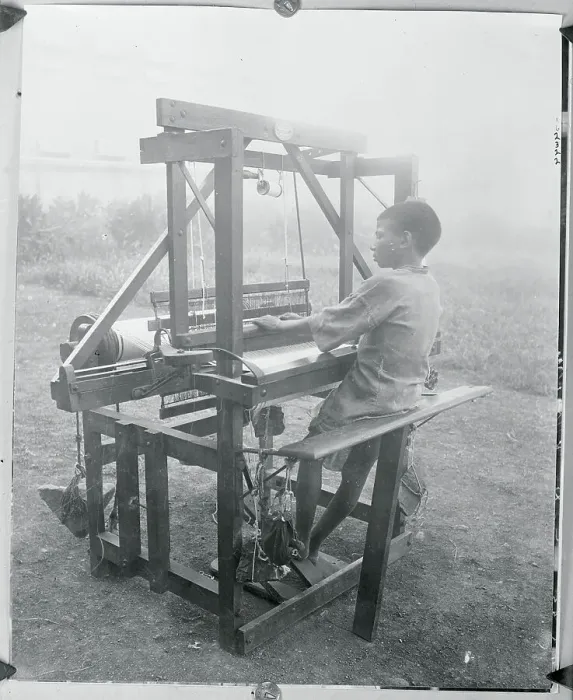Framed Print : Young Native Working with Loom