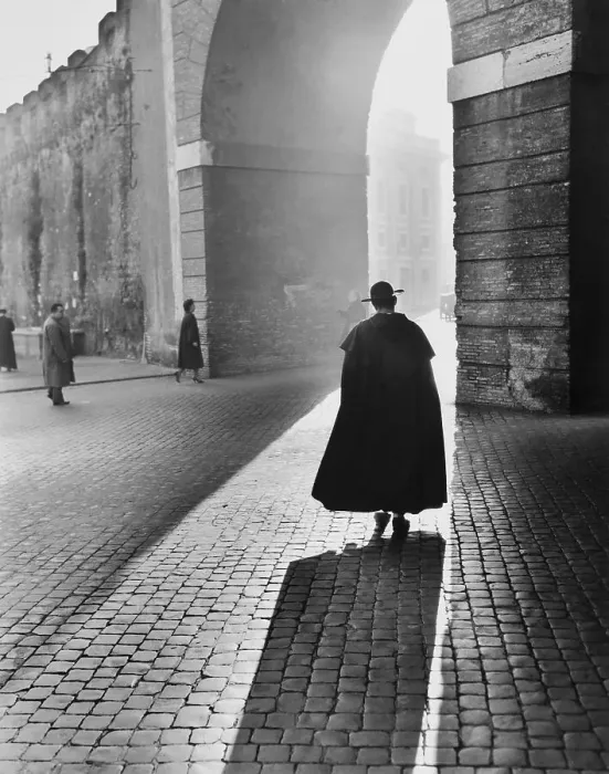 Framed Print : Young Priest Walks Toward an Arch Framed Print : Young Priest Walks Toward an Arch