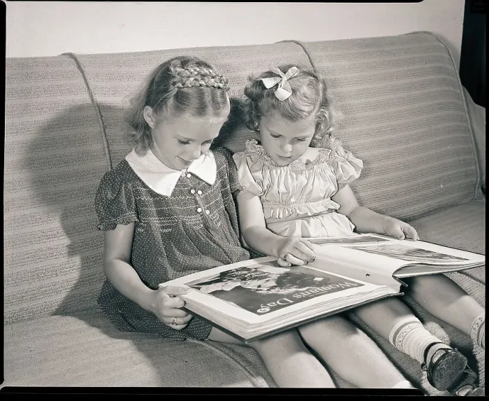 Framed Print : Young Sisters Reading