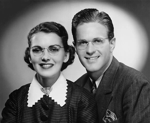 Young smiling couple, (B&W), portrait