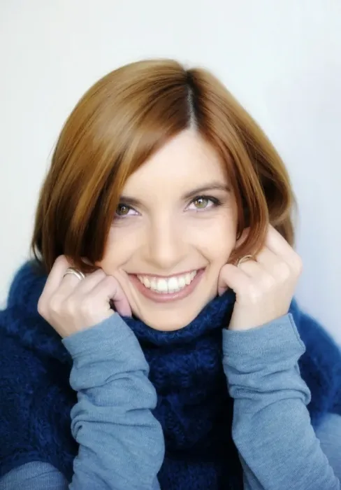 Framed Print : Young smiling woman wearing a turtleneck sweater, portrait Framed Print : Young smiling woman wearing a turtleneck sweater, portrait
