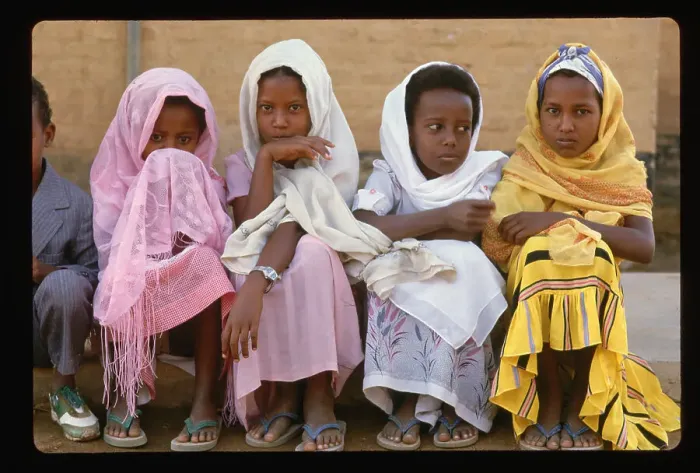 Framed Print : Young Sudanese Girls Sit at Curb Framed Print : Young Sudanese Girls Sit at Curb