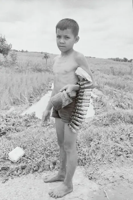 Framed Print : Young Vietnamese Boy Holding Bullet Belt Framed Print : Young Vietnamese Boy Holding Bullet Belt