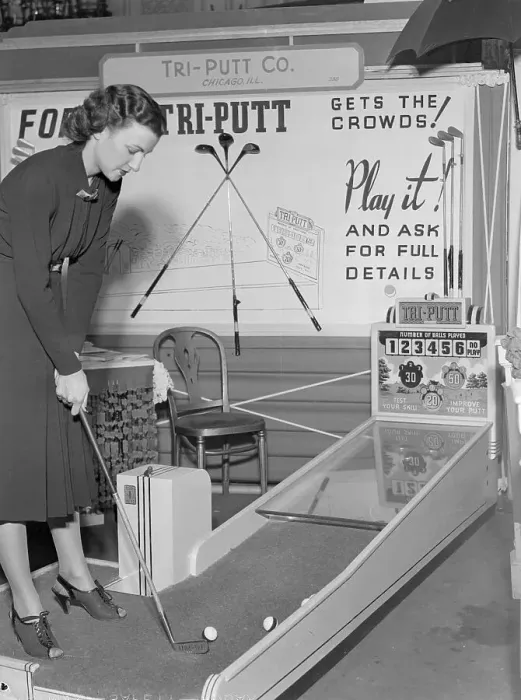 Framed Print : Young Woman Aiming Golf Club at Game Exhibit Framed Print : Young Woman Aiming Golf Club at Game Exhibit