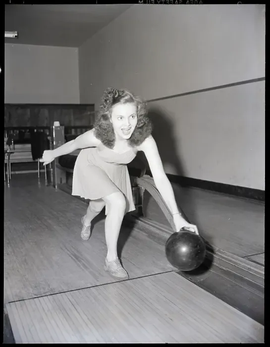 Framed Print : Young Woman Bowling Framed Print : Young Woman Bowling