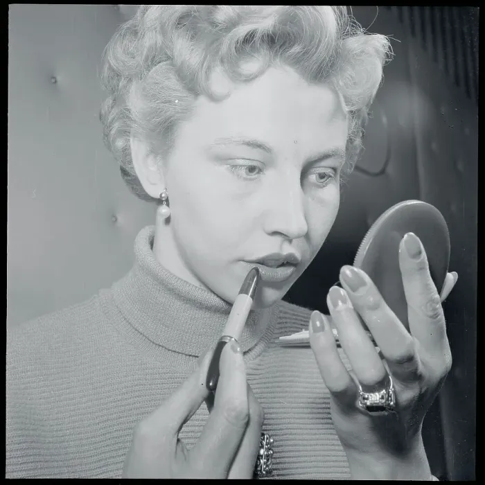 Framed Print : Young Woman with Compact Applying Lipstick Framed Print : Young Woman with Compact Applying Lipstick