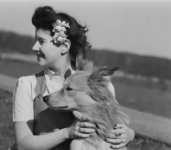 Framed Print : Young woman with dog outdoors