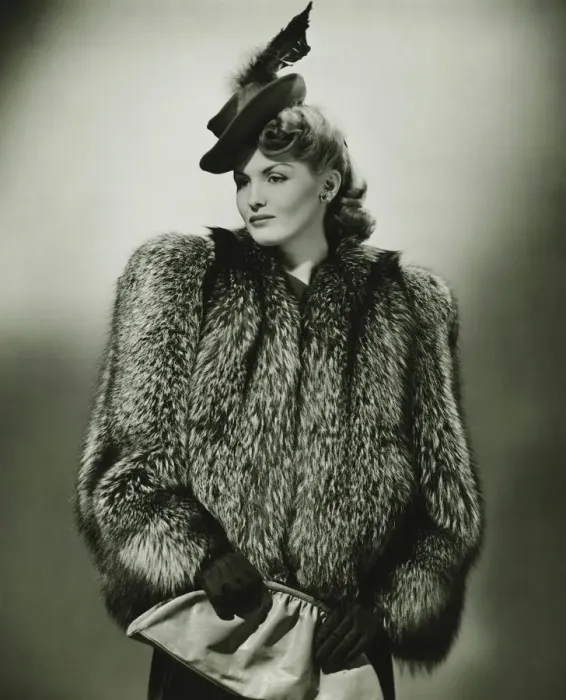 Framed Print : Young woman in fur coat and fashionable hat in studio, (B&W) Framed Print : Young woman in fur coat and fashionable hat in studio, (B&W)