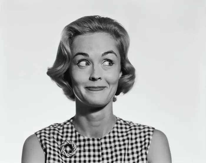 Framed Print : Young woman glancing sideways, smiling Framed Print : Young woman glancing sideways, smiling