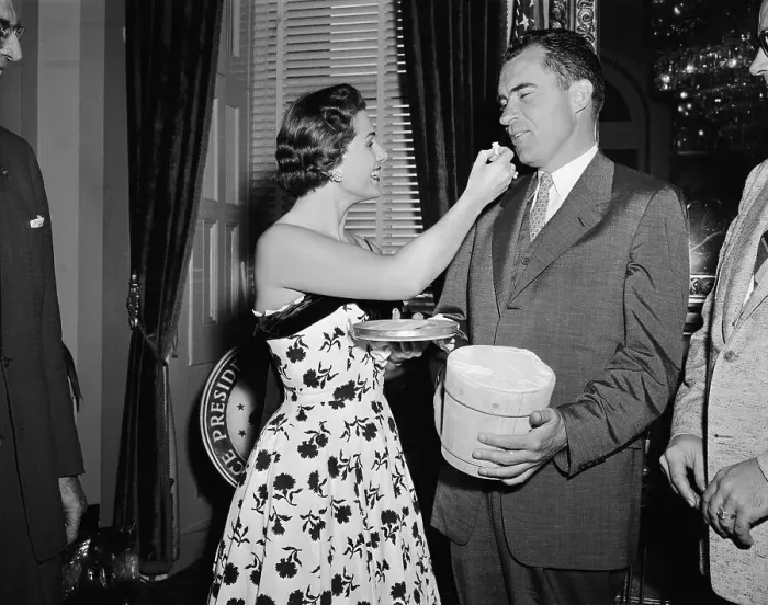 Framed Print : Young Woman Hand Feeding Richard Nixon